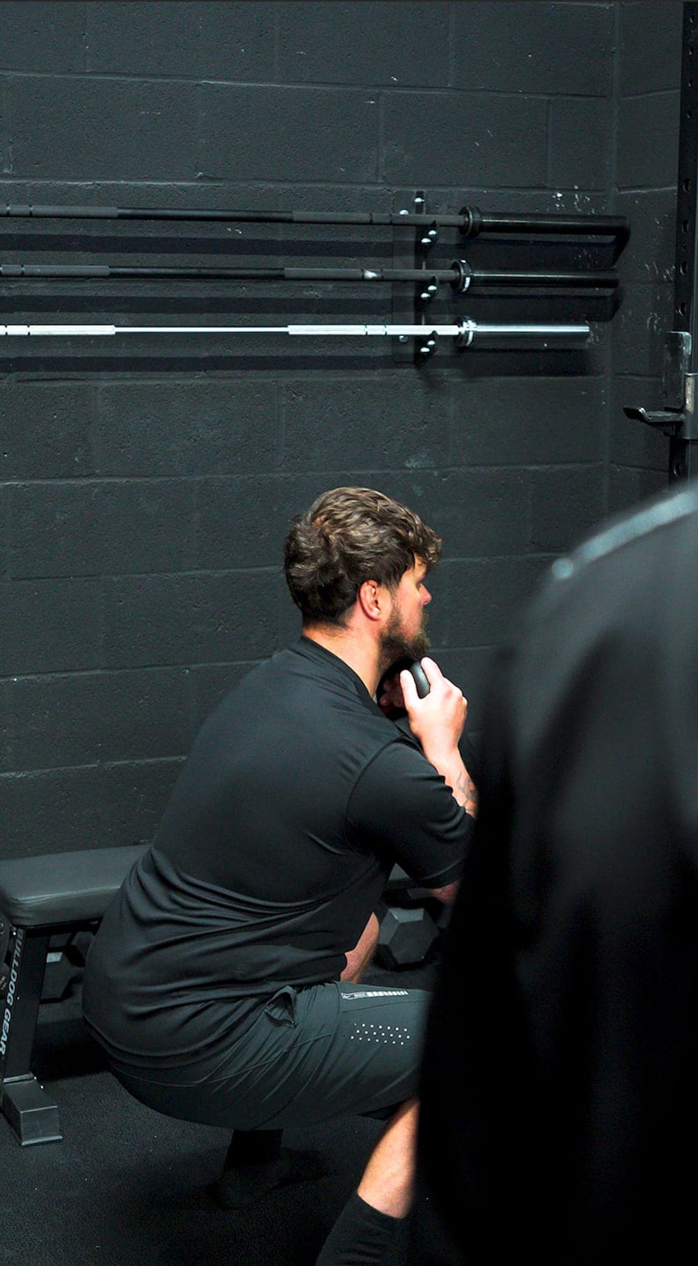 A member holding a goblet squat during a Small Group Personal Training session
