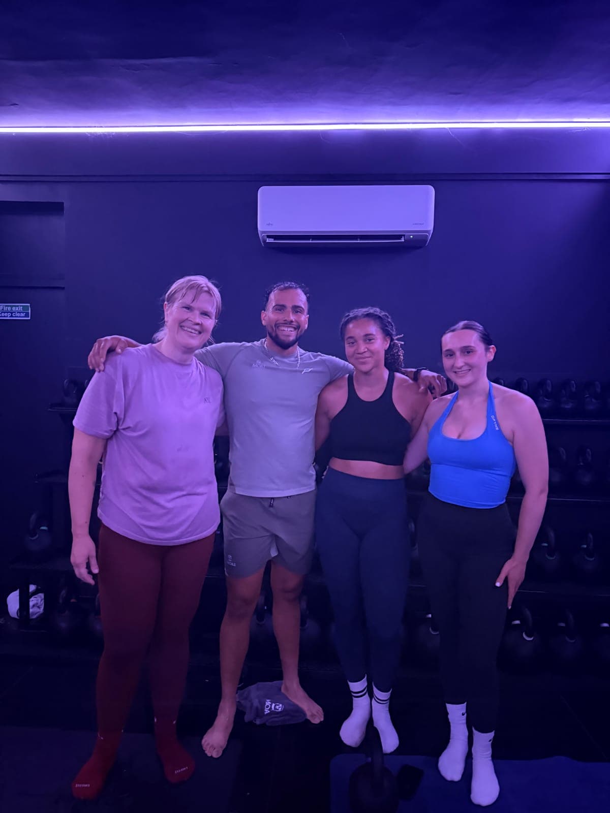 A Moai coach with members after an evening session